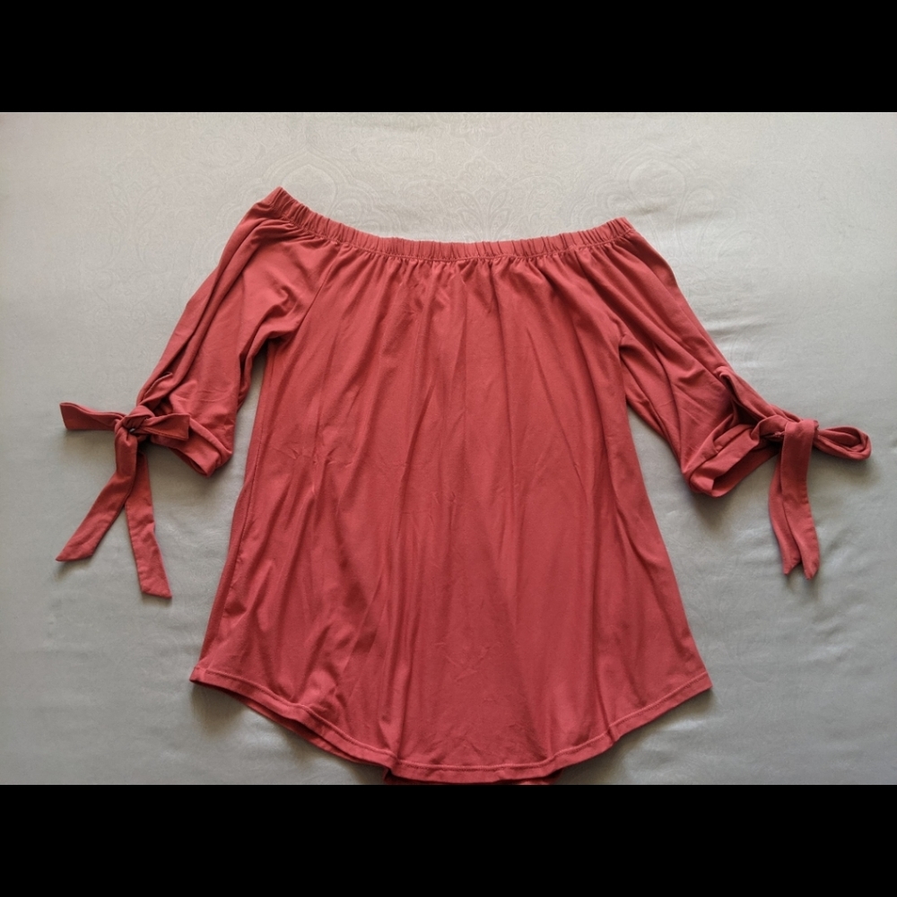 Off the shoulder flowing pink shirt